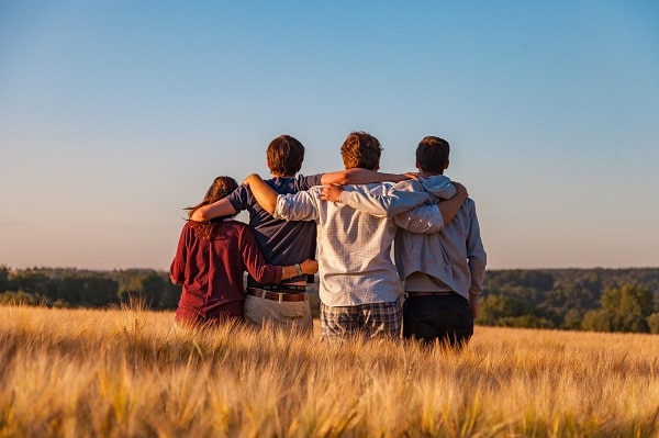 Friends hugging priorities in life