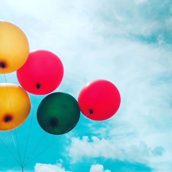 red green yellow balloons background of the sky having fun