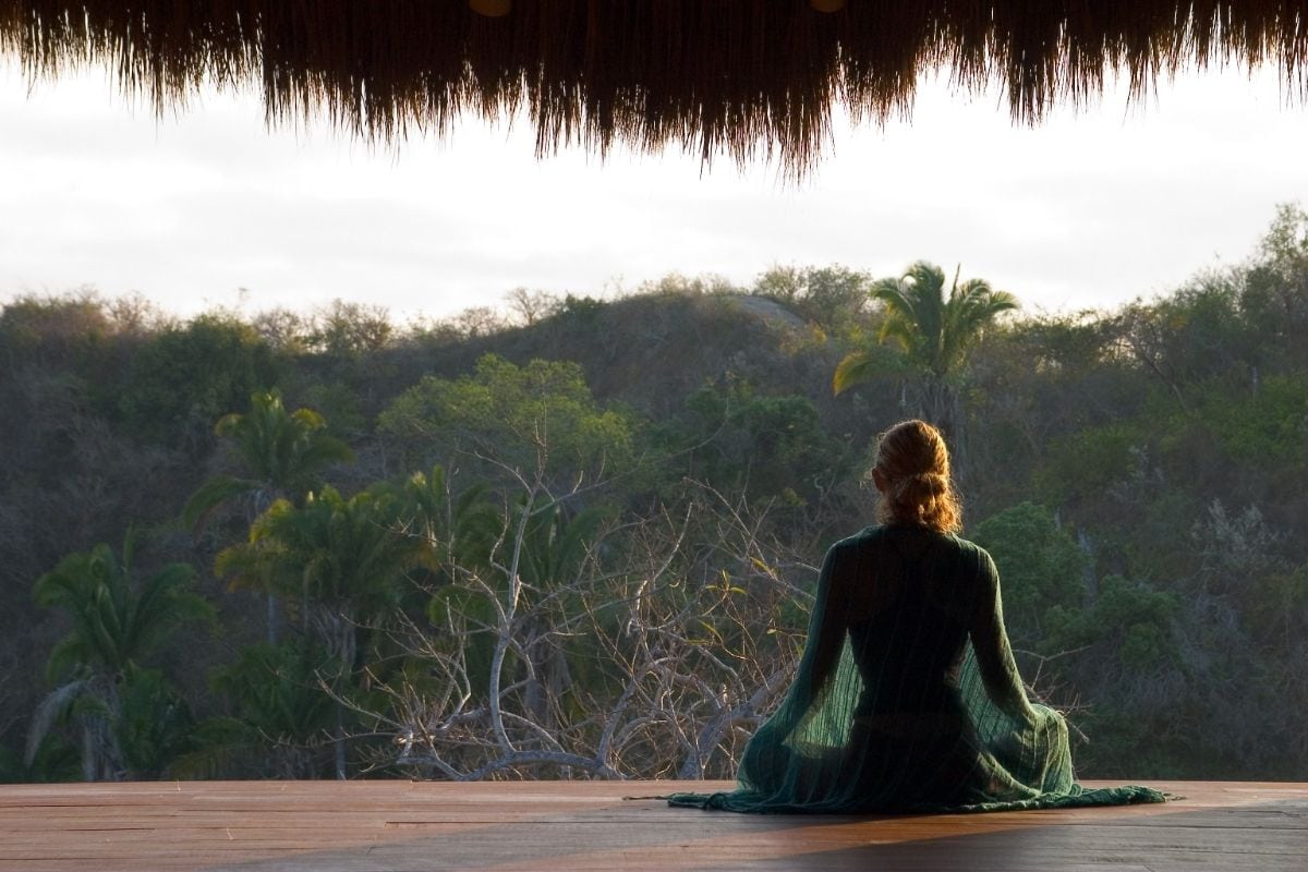 Woman meditating outside