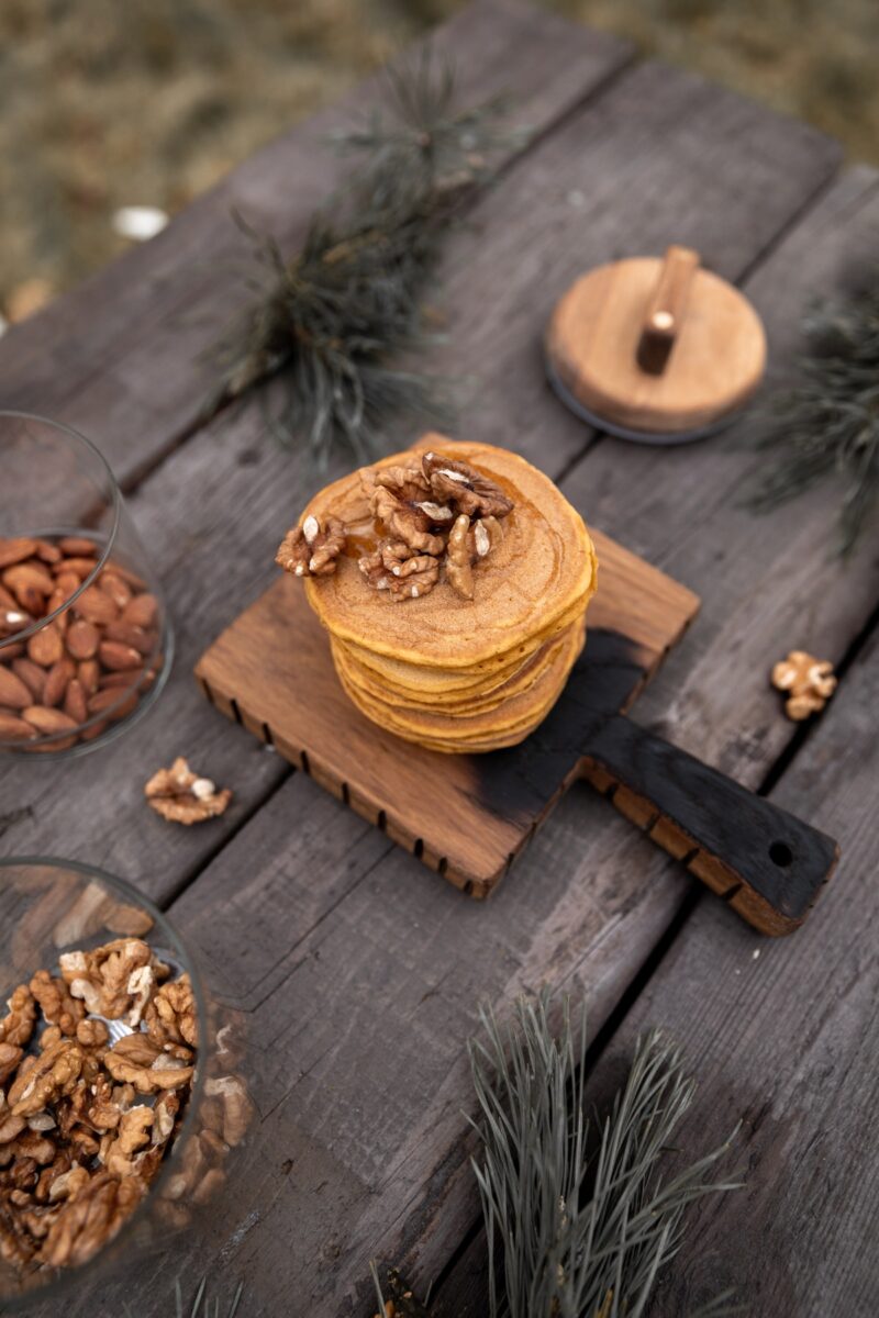Wooden table with nuts and decorations